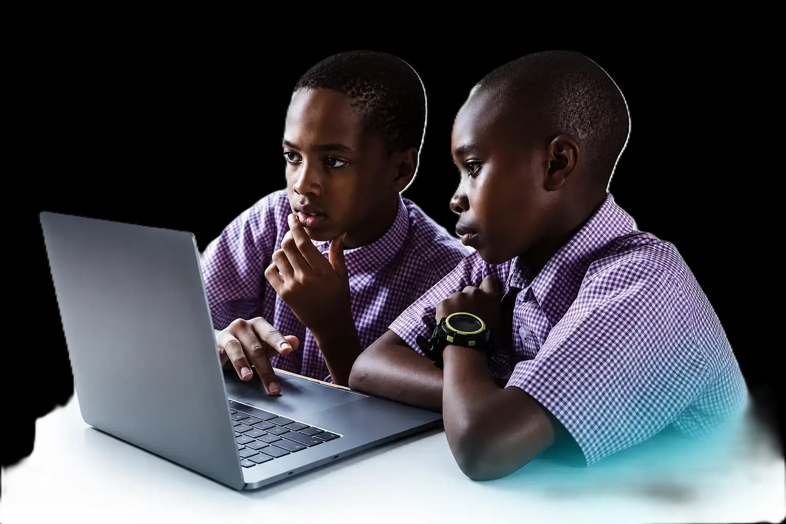 A KIT student building on a laptop with code and project ideas around them
